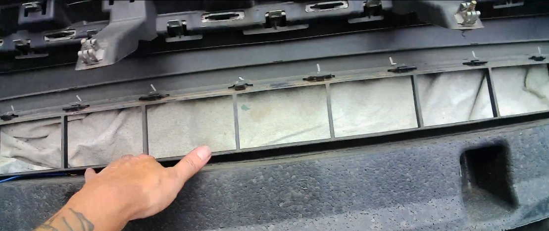 Cut plastic from bumper slot